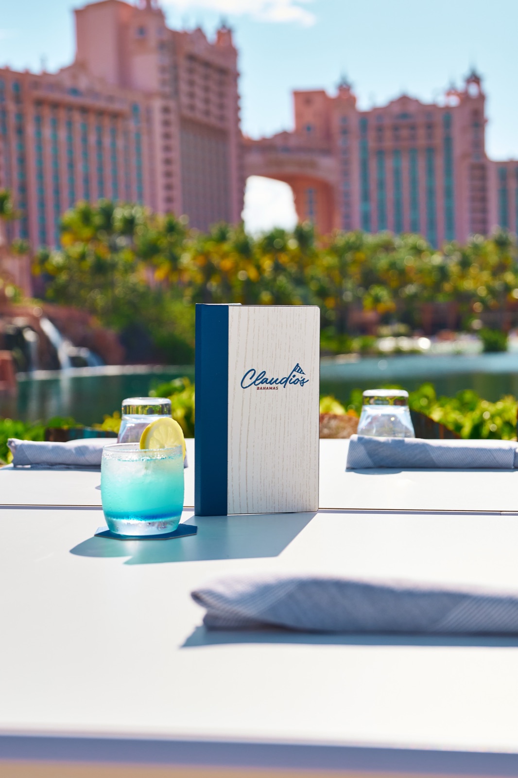 Claudio's Bahamas menu on a table overlooking the Atlantis Royal Towers